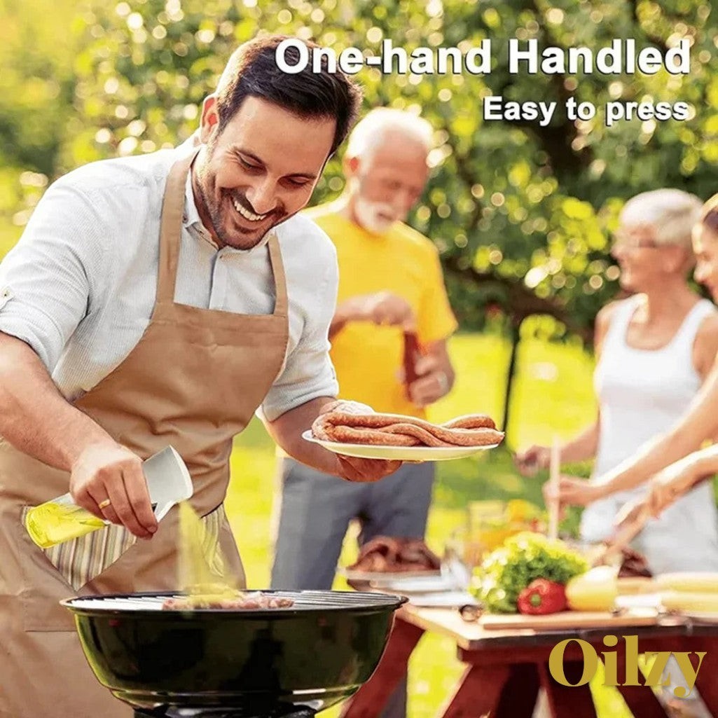 Gr8est Oilzy kitchen oil spray bottle used by a man grilling sausages outdoors for a healthy cooking experience