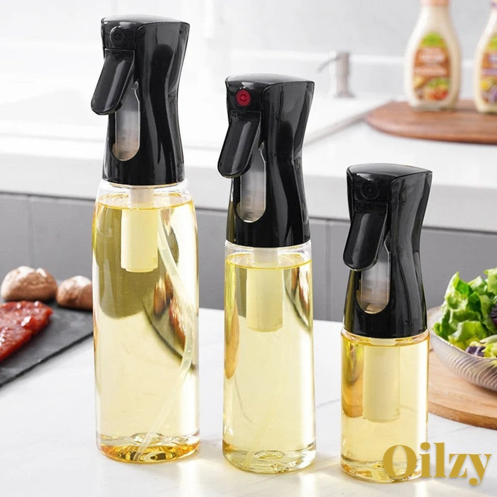 Gr8est Oilzy kitchen oil spray bottles in 200ml, 300ml, and 500ml sizes with clear containers and black misting nozzles.