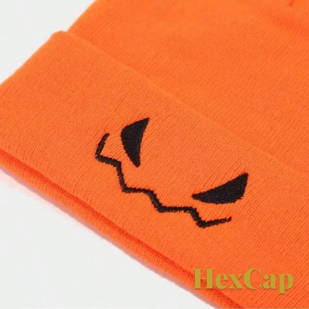 Gr8est orange knit beanie with black embroidered jack-o-lantern eyes for Halloween and autumn wear