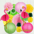 Gr8est Paradeco Hawaiian party decorations featuring pink flamingo and pineapple honeycomb balls, lanterns, and fans.