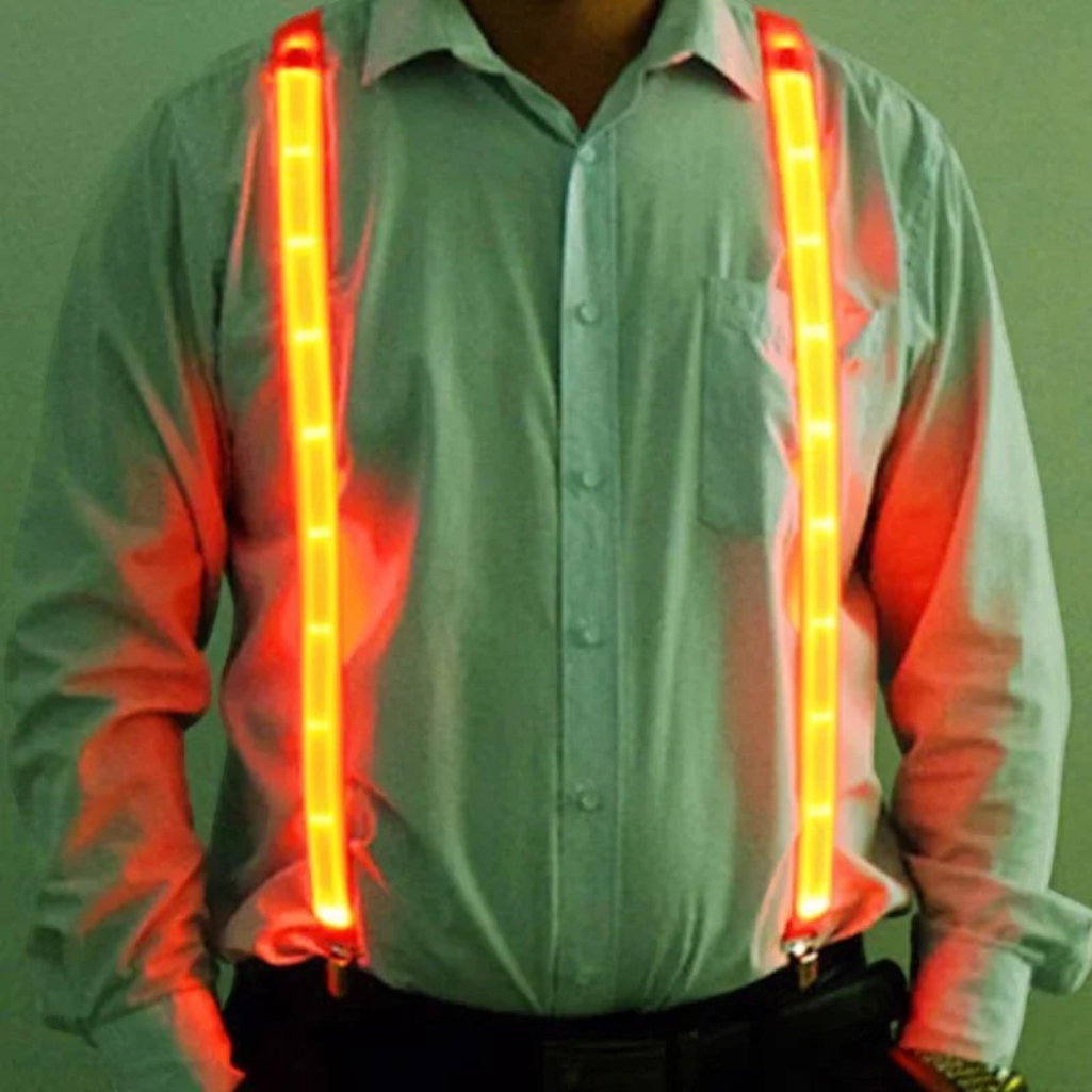 Gr8est Phosphorico LED light-up suspenders in red glowing microfiber worn over a light shirt for raves and parties