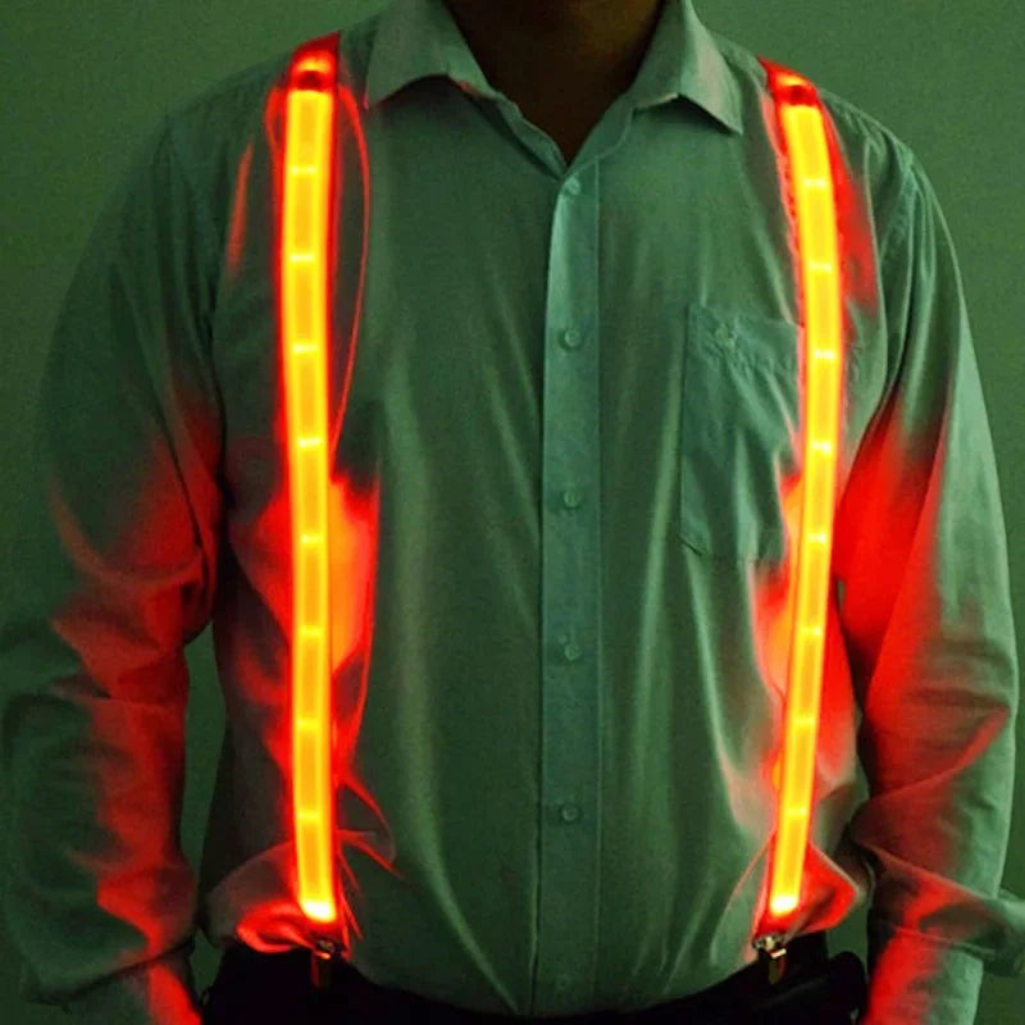 Gr8est Phosphorico LED light-up suspenders in glowing red, worn over a light shirt for raves and parties.
