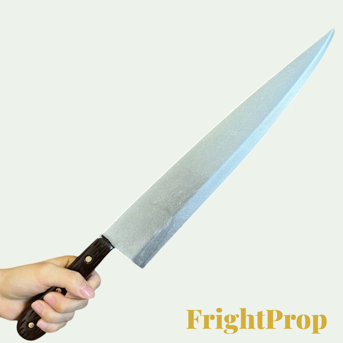 Gr8est PU rubber knife prop for Halloween cosplay, featuring a silver blade and dark brown handle held in a hand.