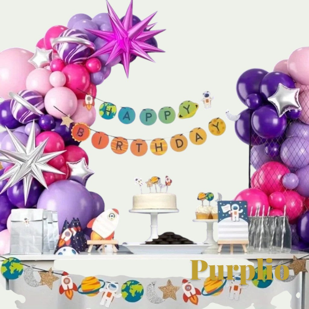 Gr8est Purplio hot pink and purple balloon garland arch kit with space-themed birthday decorations and cake table