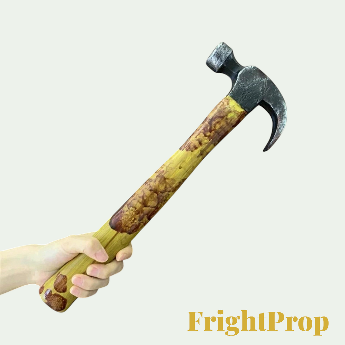 Gr8est realistic PU foam hammer prop for Halloween costumes and cosplay, held in a hand against a plain background.