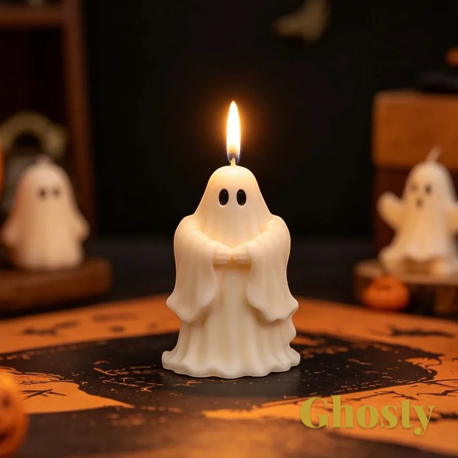 Gr8est saluting ghost candle made from a silicone mold, featuring a white wax figure with a lit wick on a table.
