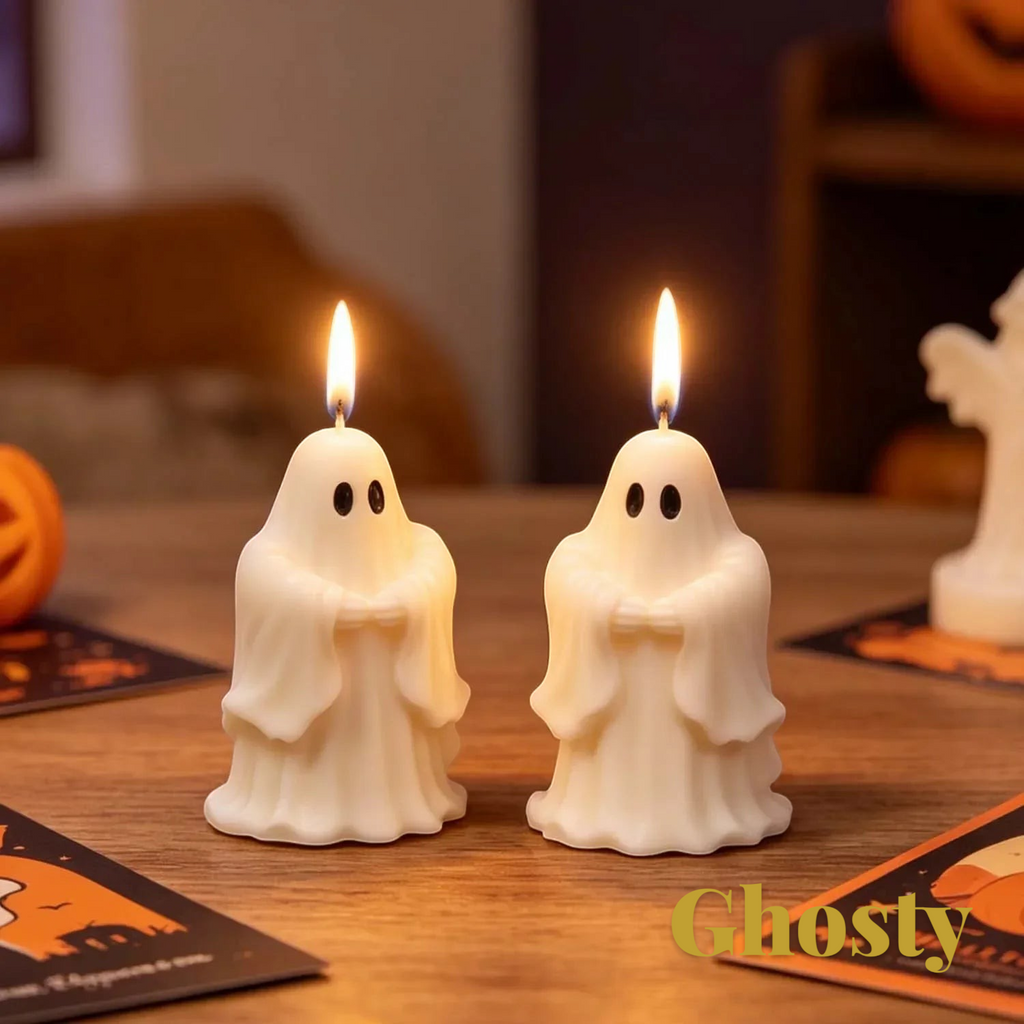 Gr8est Ghosty saluting ghost candles in white wax with lit wicks on a wooden table for Halloween decor