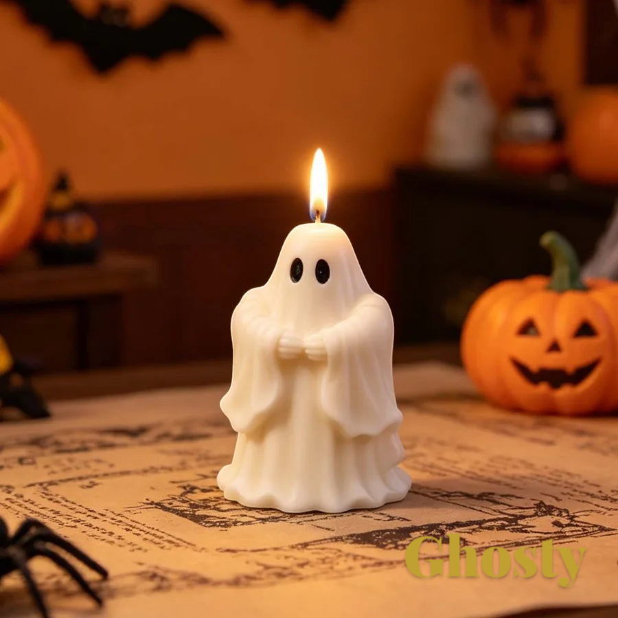 Gr8est saluting ghost candle made from a silicone mold, displayed on a table with Halloween decorations.