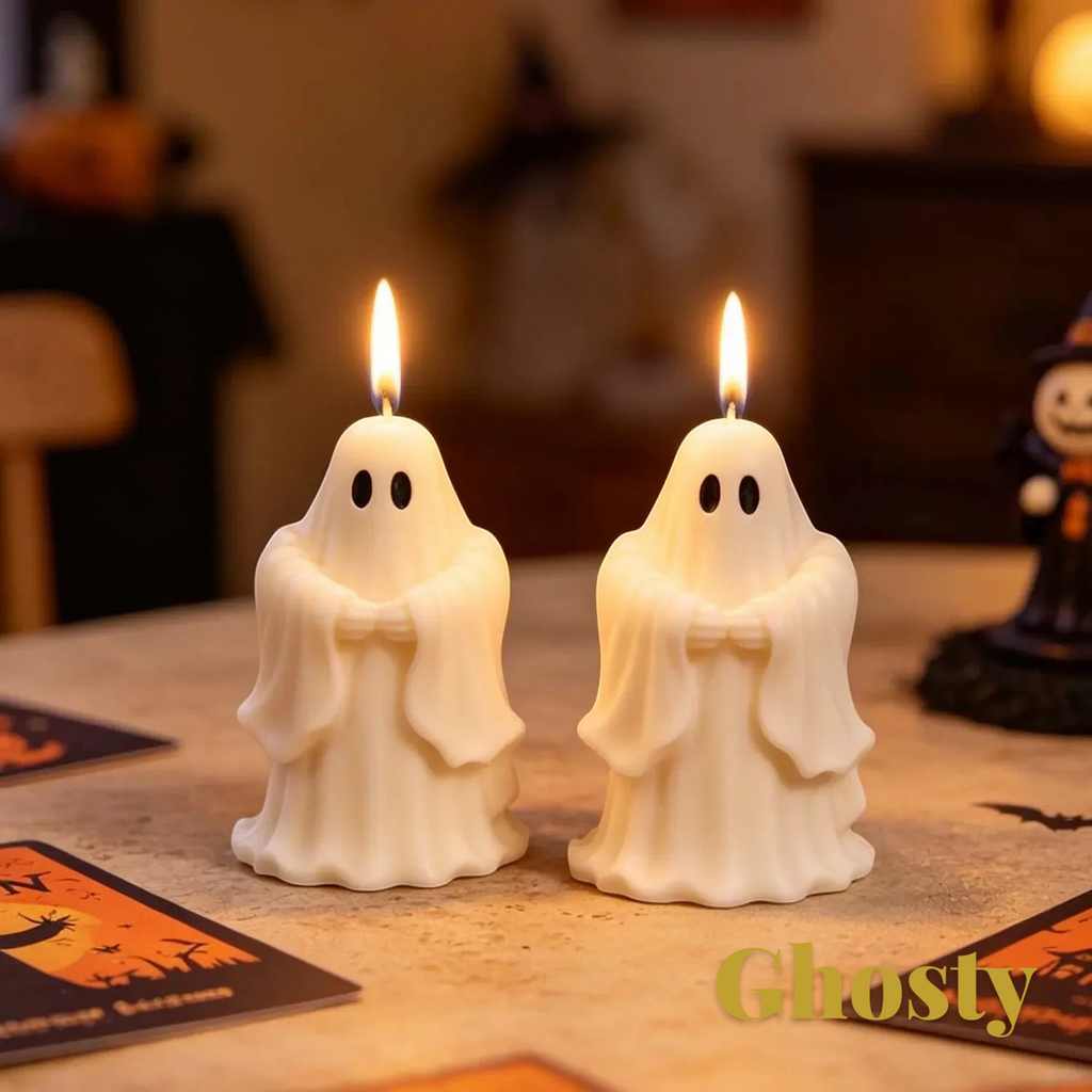 Gr8est Ghosty saluting ghost candles with lit wicks on a table for Halloween decor