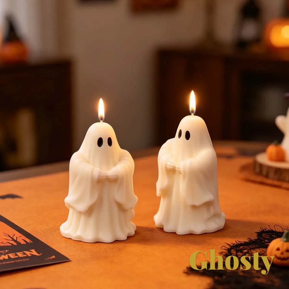 Gr8est saluting ghost candles in white wax with lit wicks on a table for Halloween decor