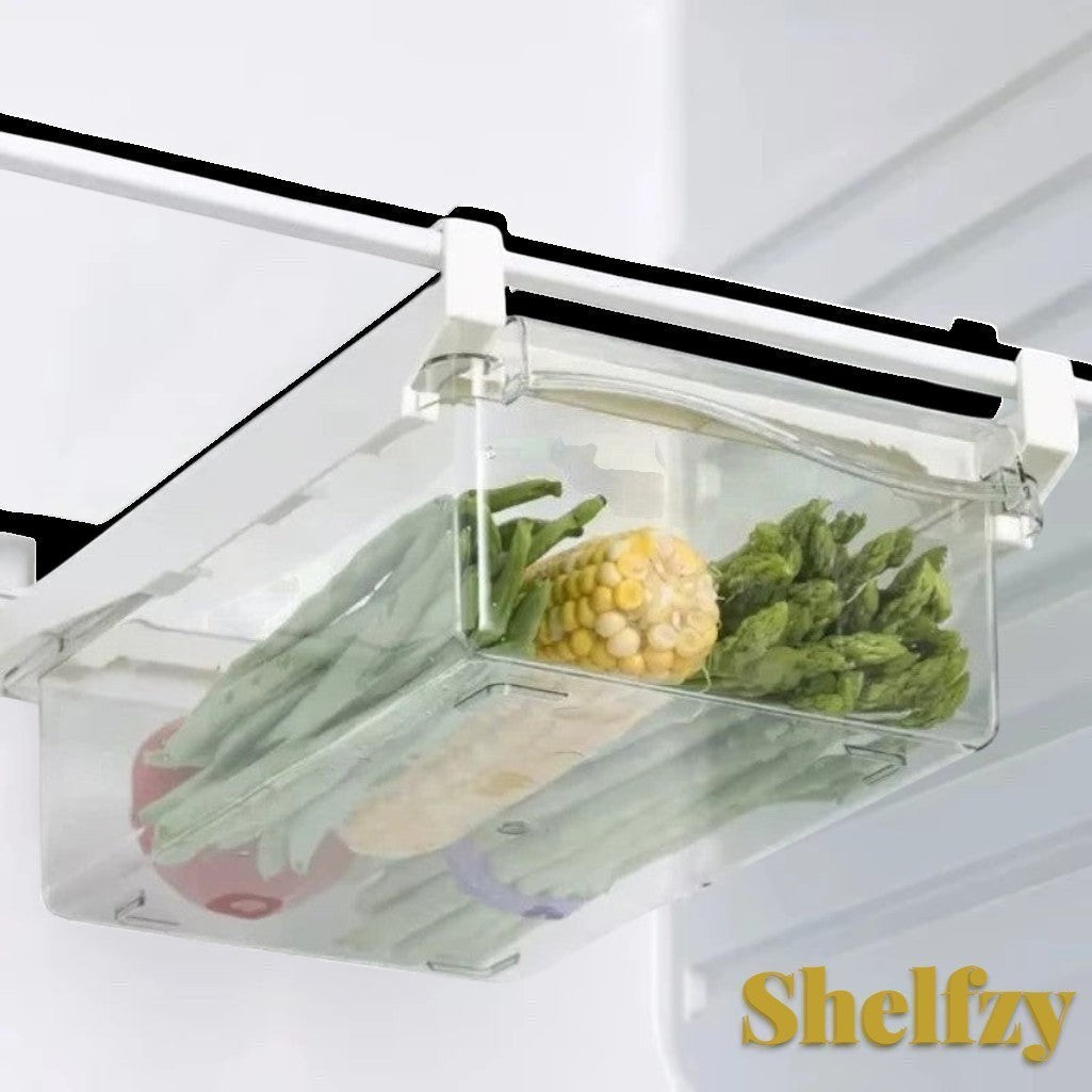 Gr8est Shelfzy clear plastic under-shelf fridge drawer filled with fresh vegetables like corn and green beans.