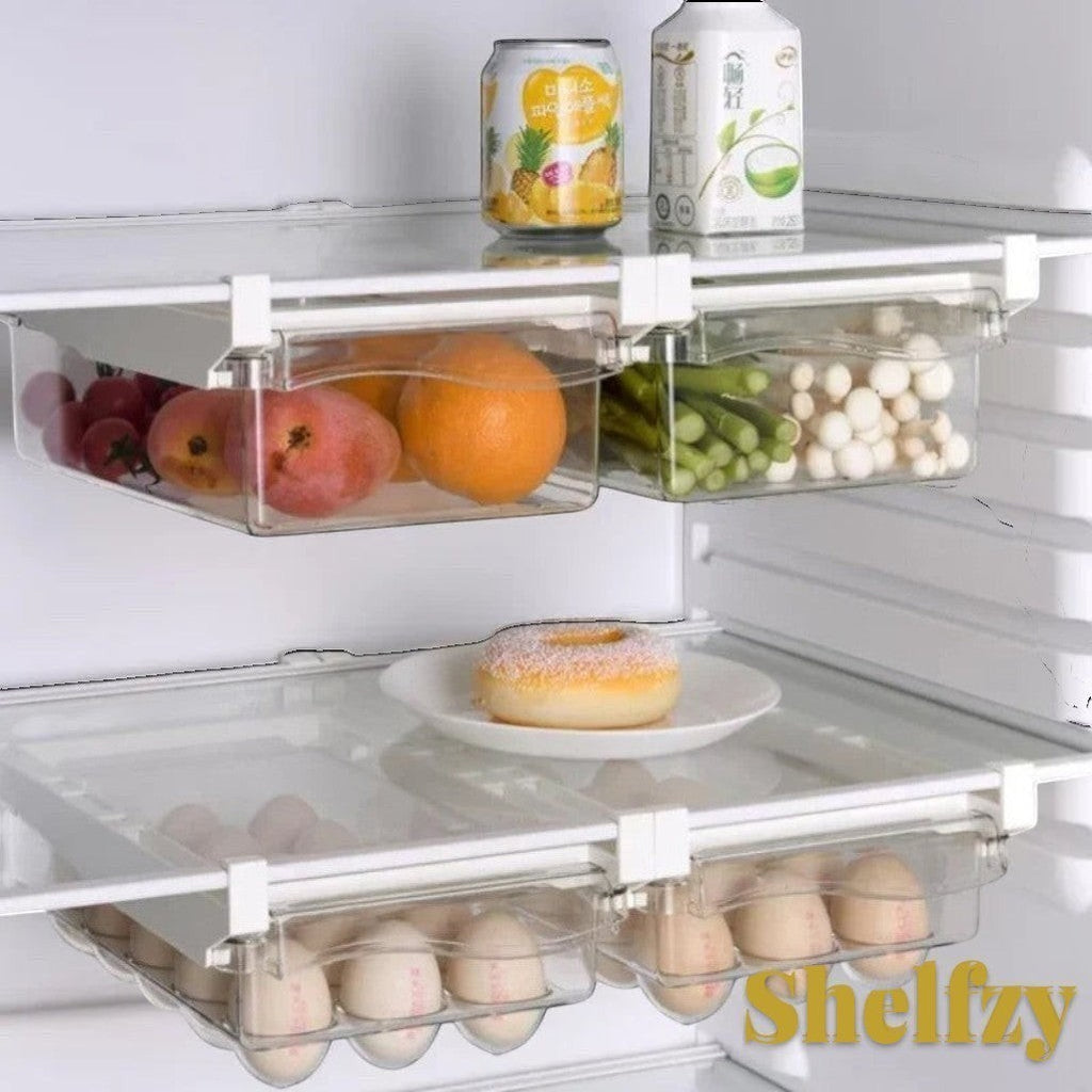 Gr8est Shelfzy clear plastic under-shelf fridge drawer organizers holding fruits, vegetables, and eggs in a fridge.