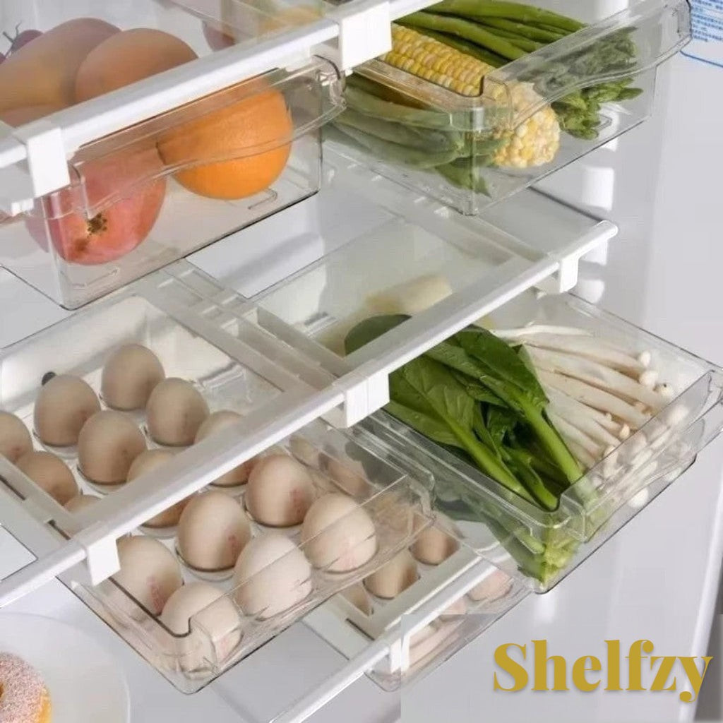 Gr8est Shelfzy clear plastic pull-out fridge drawer organizers holding eggs and fresh produce on refrigerator shelves.