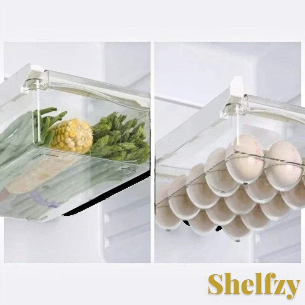 Gr8est Shelfzy clear plastic under-shelf fridge drawer organizer holding fresh vegetables and eggs in a refrigerator.