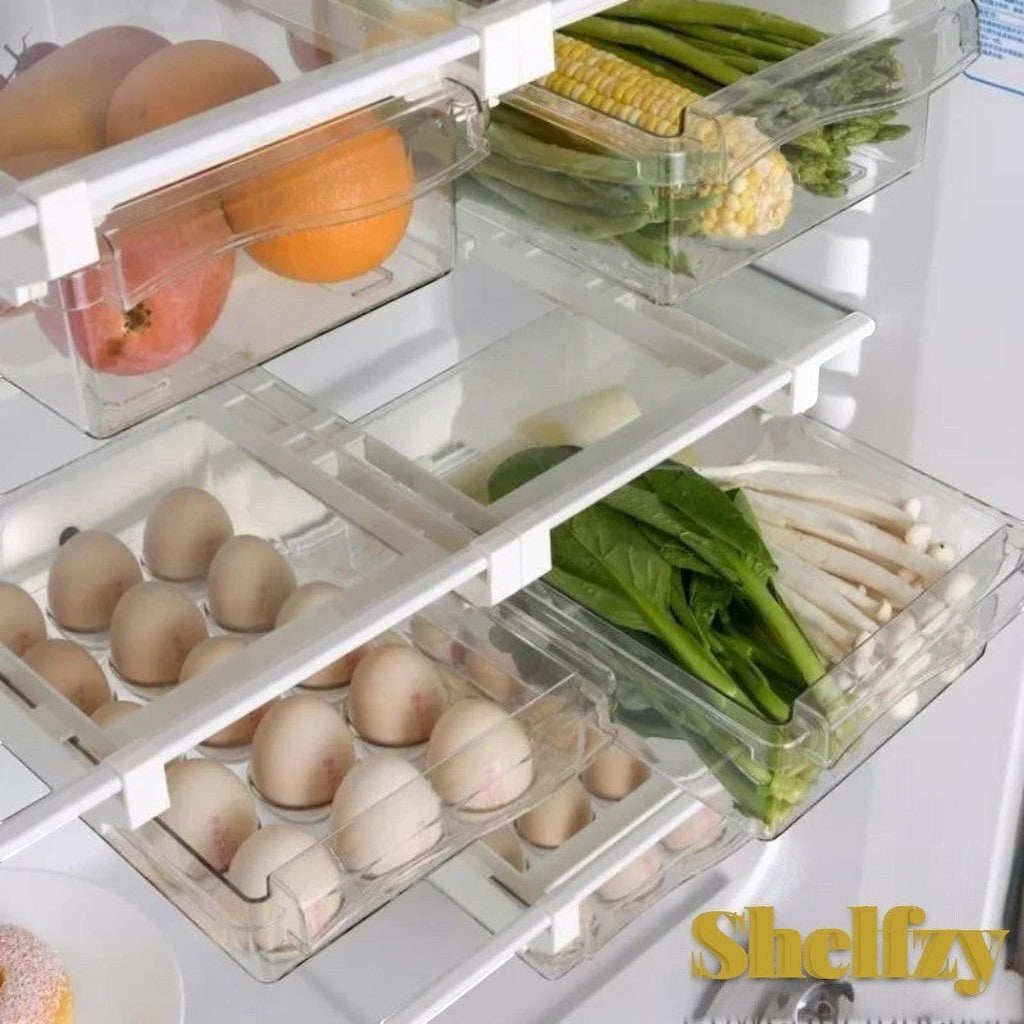 Gr8est Shelfzy clear plastic pull-out fridge drawer organizers holding eggs, fruits, and vegetables on refrigerator shelves.
