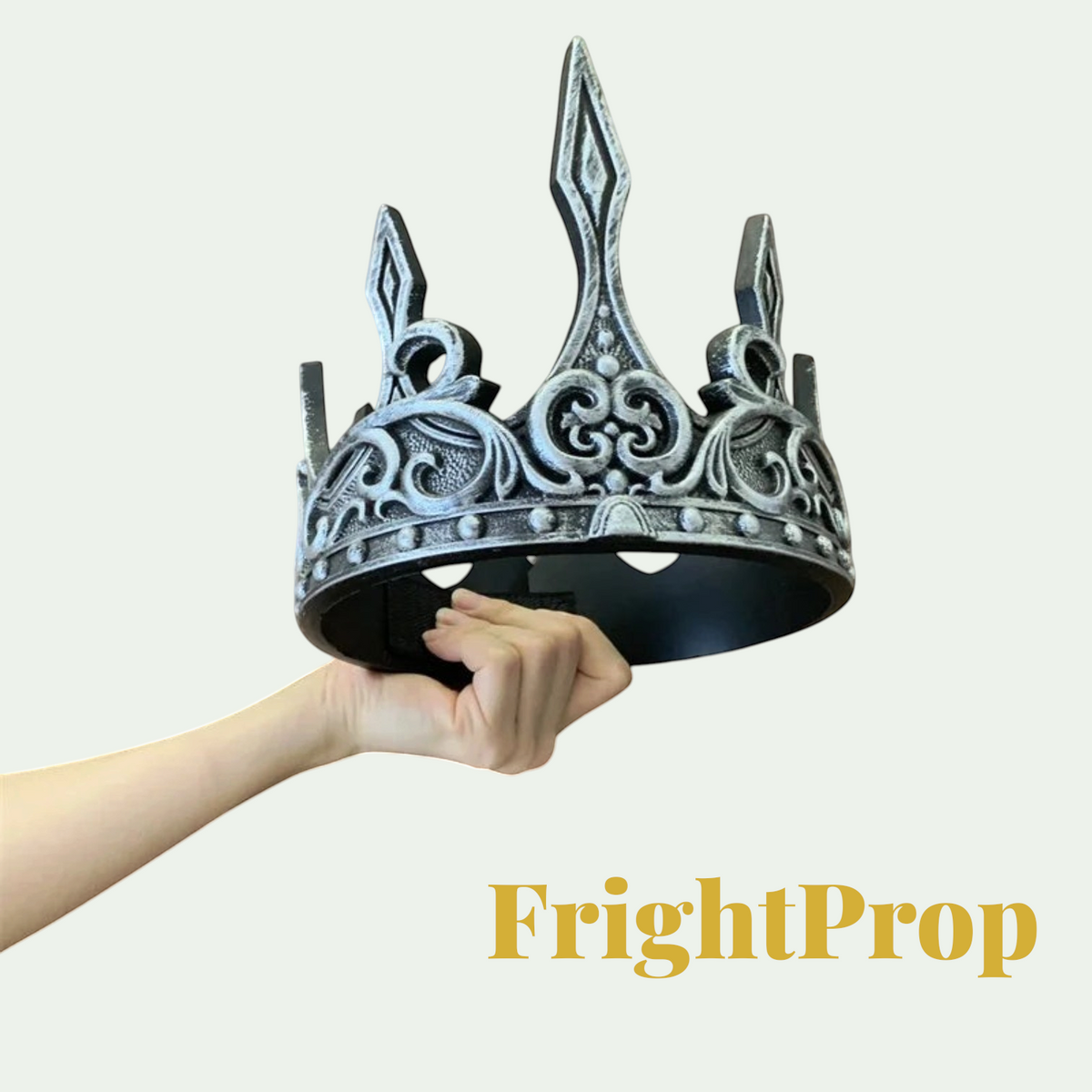 Gr8est ornate silver and black crown prop for Halloween costumes and cosplay, held in a hand