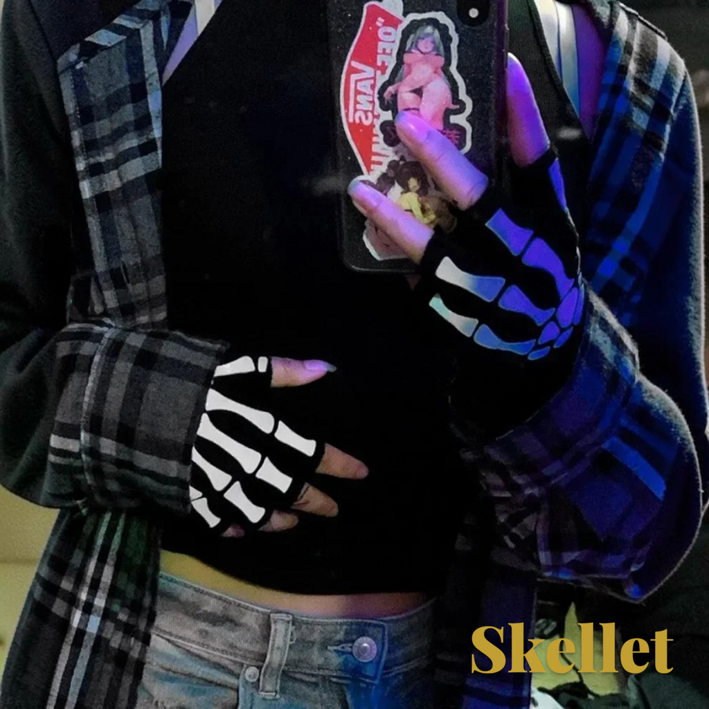 Gr8est fingerless gloves with white skeleton hand print on black fabric, worn by a person in a plaid shirt.