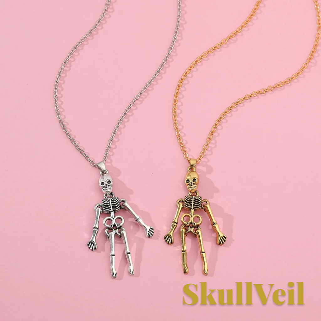 Gr8est Skullveil gothic skeleton pendant necklaces in silver and gold metal tones on a pink background
