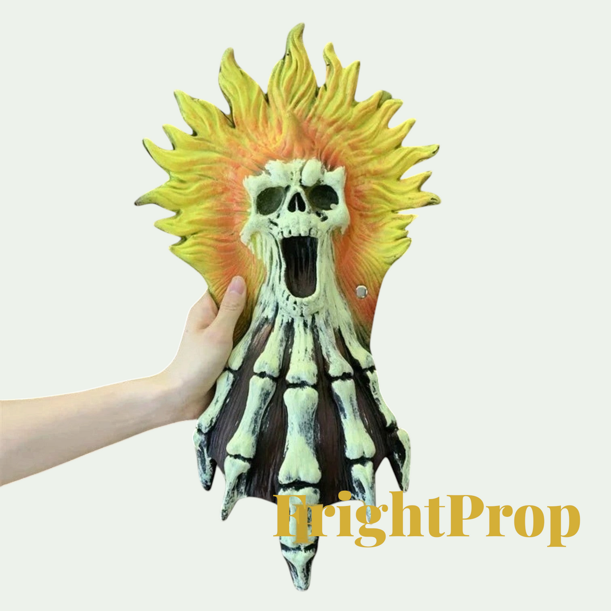 Gr8est skull and hand Halloween prop with yellow flame design made of soft PU material for cosplay and parties