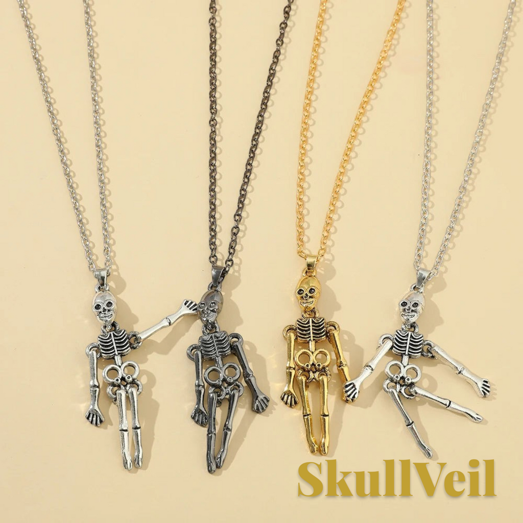 Gr8est Skullveil gothic skeleton pendant necklaces in silver, black, and gold metal finishes on a beige background.
