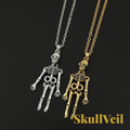 Gr8est Skullveil gothic skeleton pendant necklaces in silver and gold metal tones on a black background