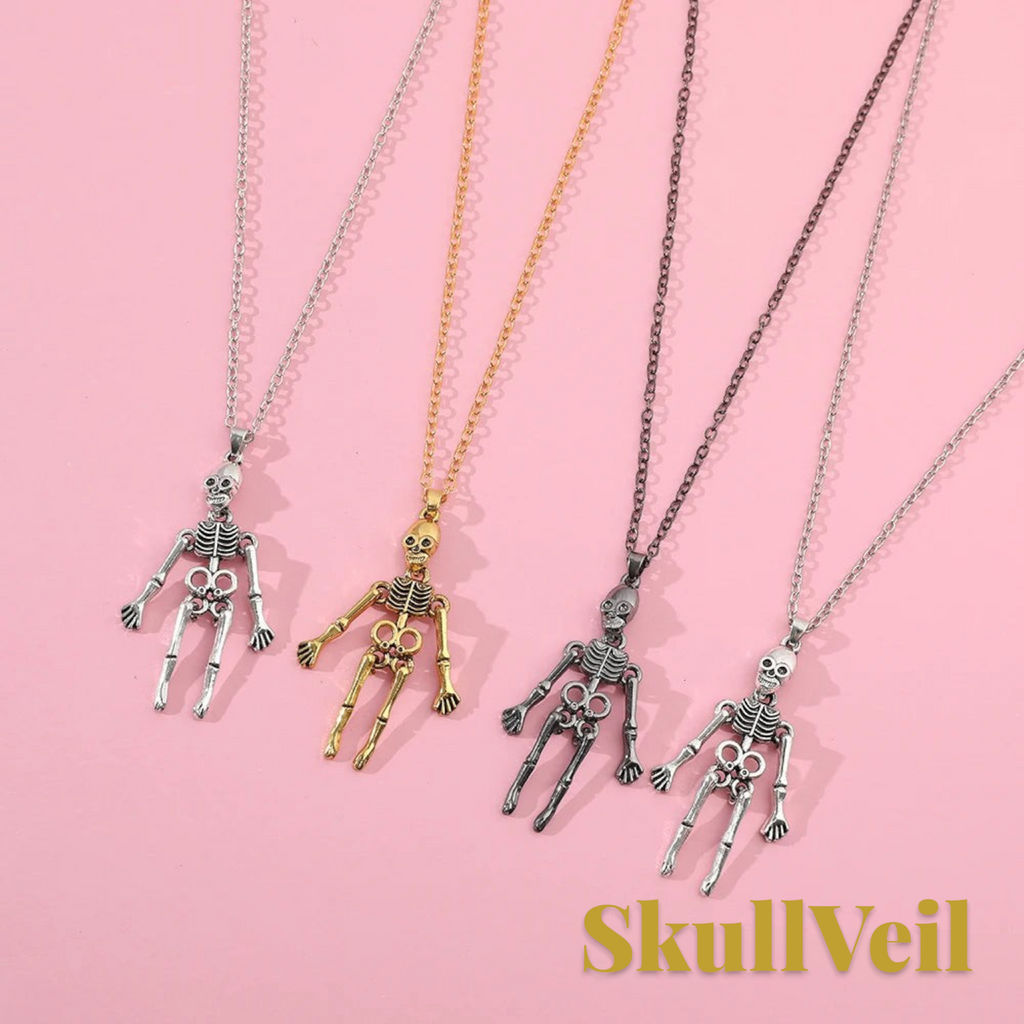 Gr8est Skullveil gothic skeleton pendant necklaces in silver, gold, and dark metal finishes on a pink background