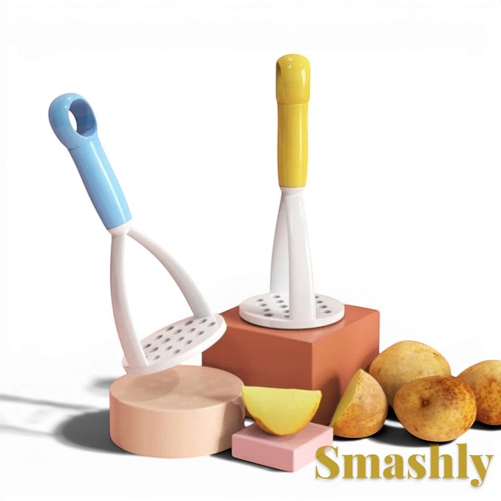 Gr8est Smashly blue and yellow plastic potato mashers displayed on geometric blocks with fresh potatoes.