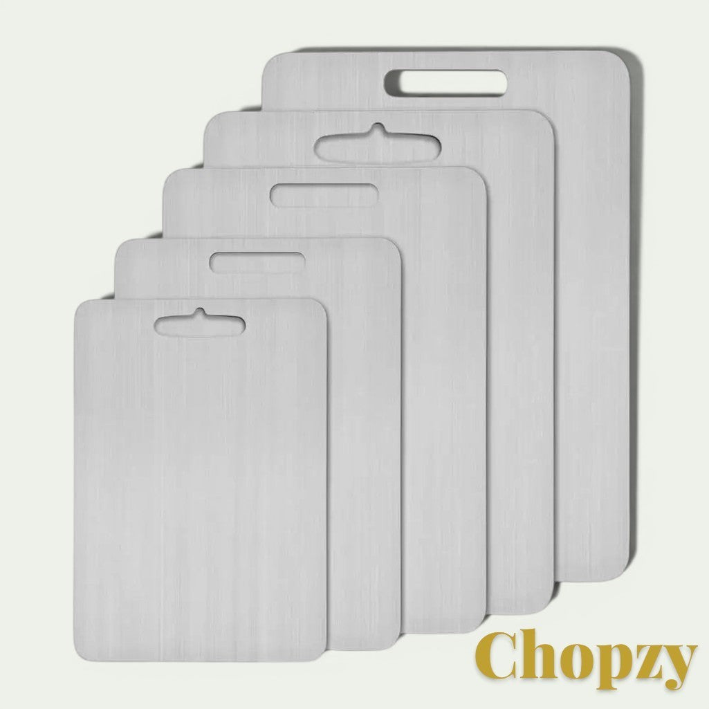 Gr8est stainless steel cutting boards in five graduated sizes with integrated handles for easy kitchen storage.