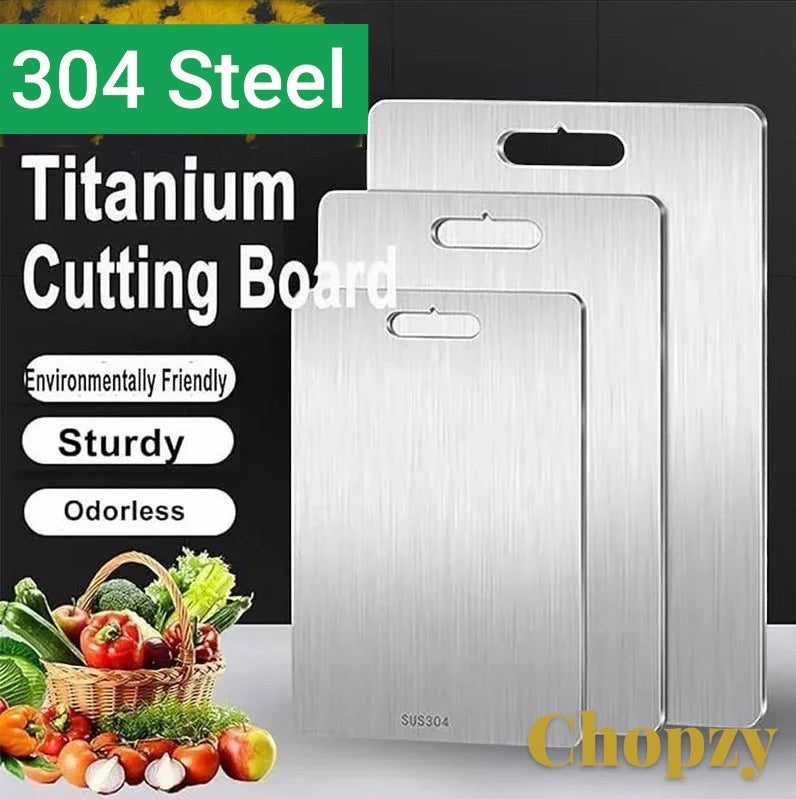 Gr8est stainless steel cutting boards in three sizes with convenient handle cutouts for kitchen food preparation.