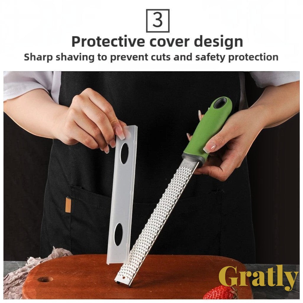 Gr8est stainless steel multi-purpose grater with a green ergonomic handle and protective safety cover.
