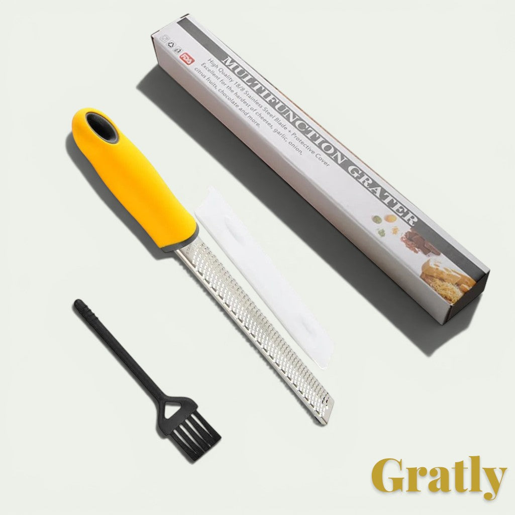 Gr8est stainless steel multi-purpose grater with a yellow ergonomic handle, protective cover, and cleaning brush.