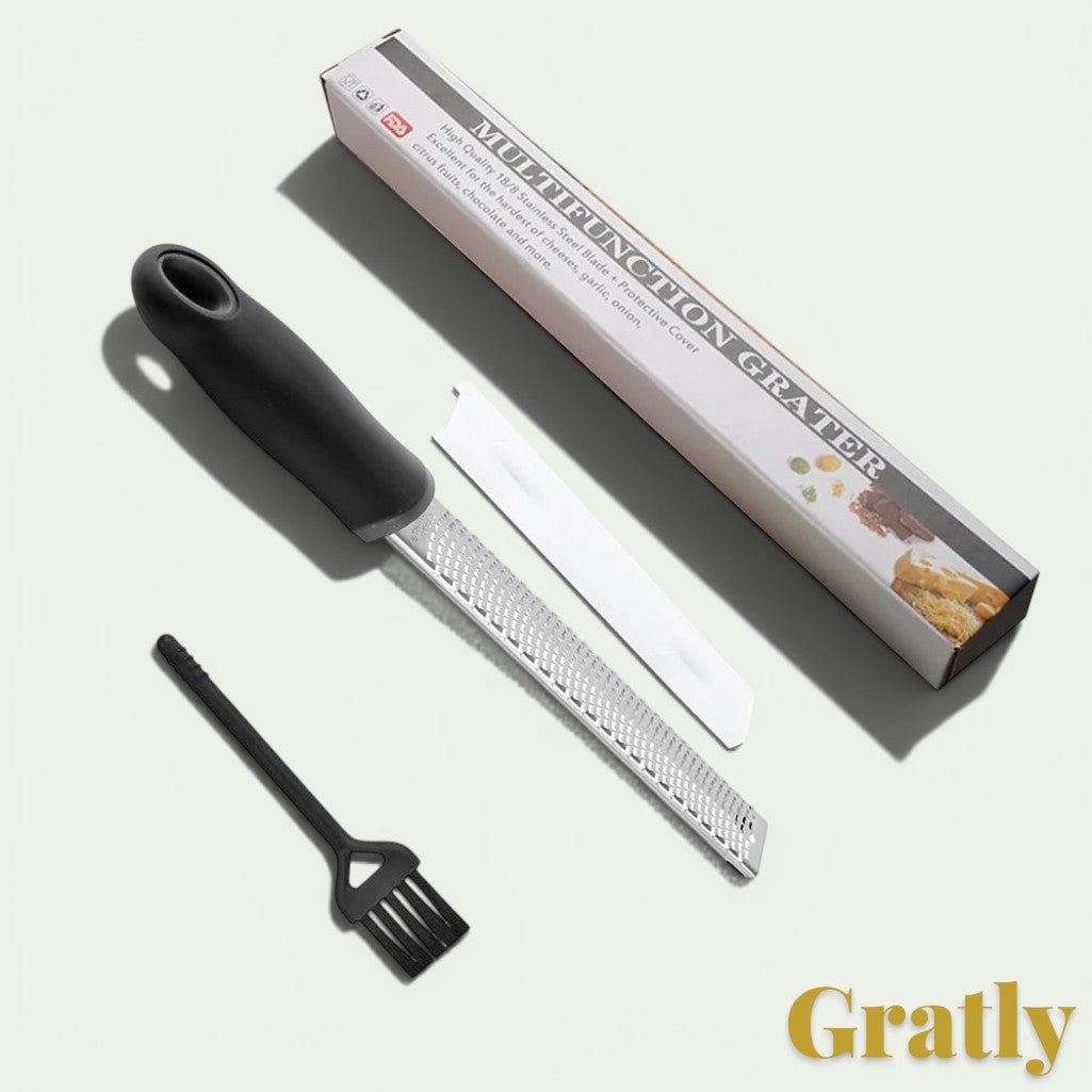 Gr8est stainless steel multi-purpose grater with black ergonomic handle, protective cover, and cleaning brush.