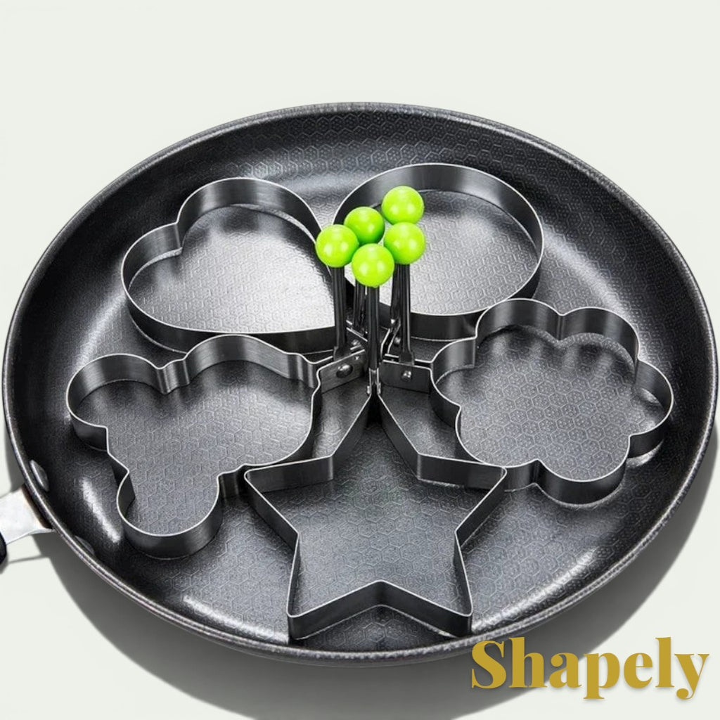 Gr8est stainless steel multi-shape egg and pancake mold set with green handles for fun breakfast cooking