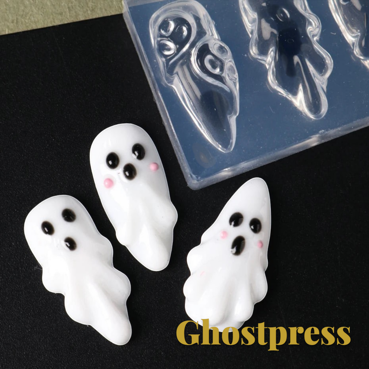 Gr8est Store 3D ghost nail art mold with three finished white ghost charms on a black background