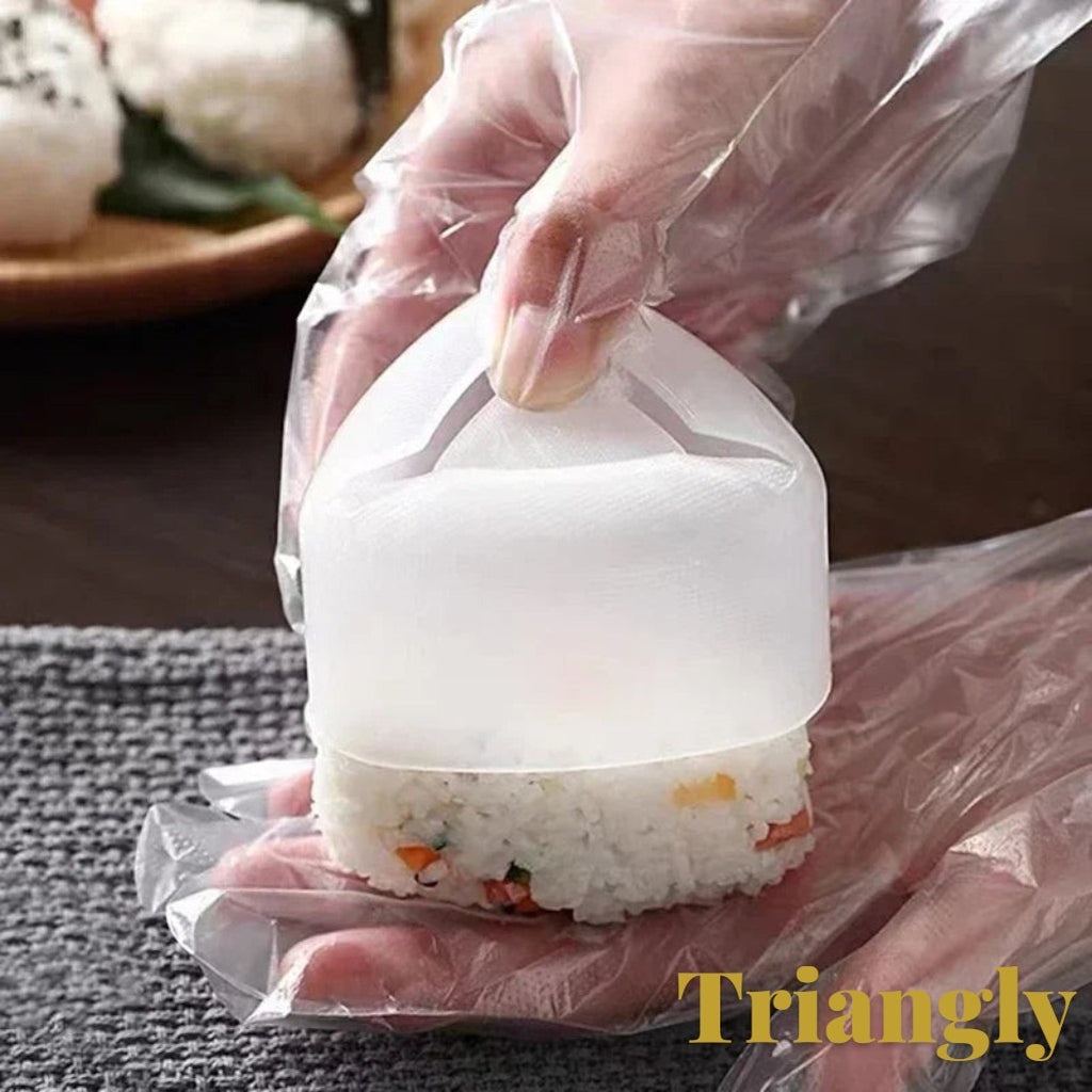 Gr8est triangle sushi and onigiri rice ball mold being used to shape a rice ball with gloved hands
