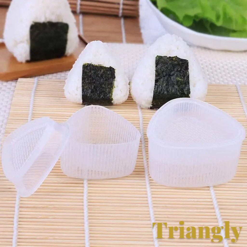 Gr8est triangle sushi and onigiri rice ball mold with two freshly prepared rice balls on a bamboo mat