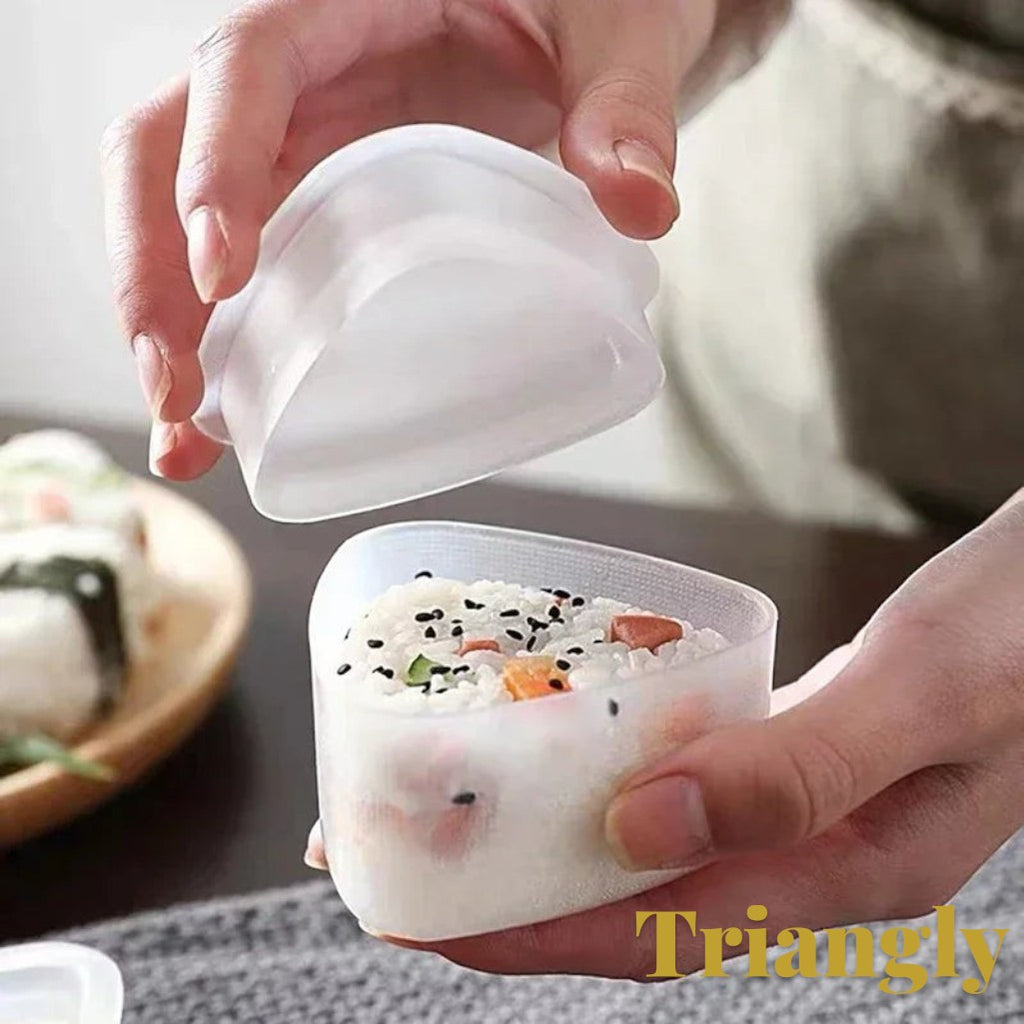 Gr8est triangle sushi and onigiri rice ball mold being used to shape a rice ball with sesame seeds