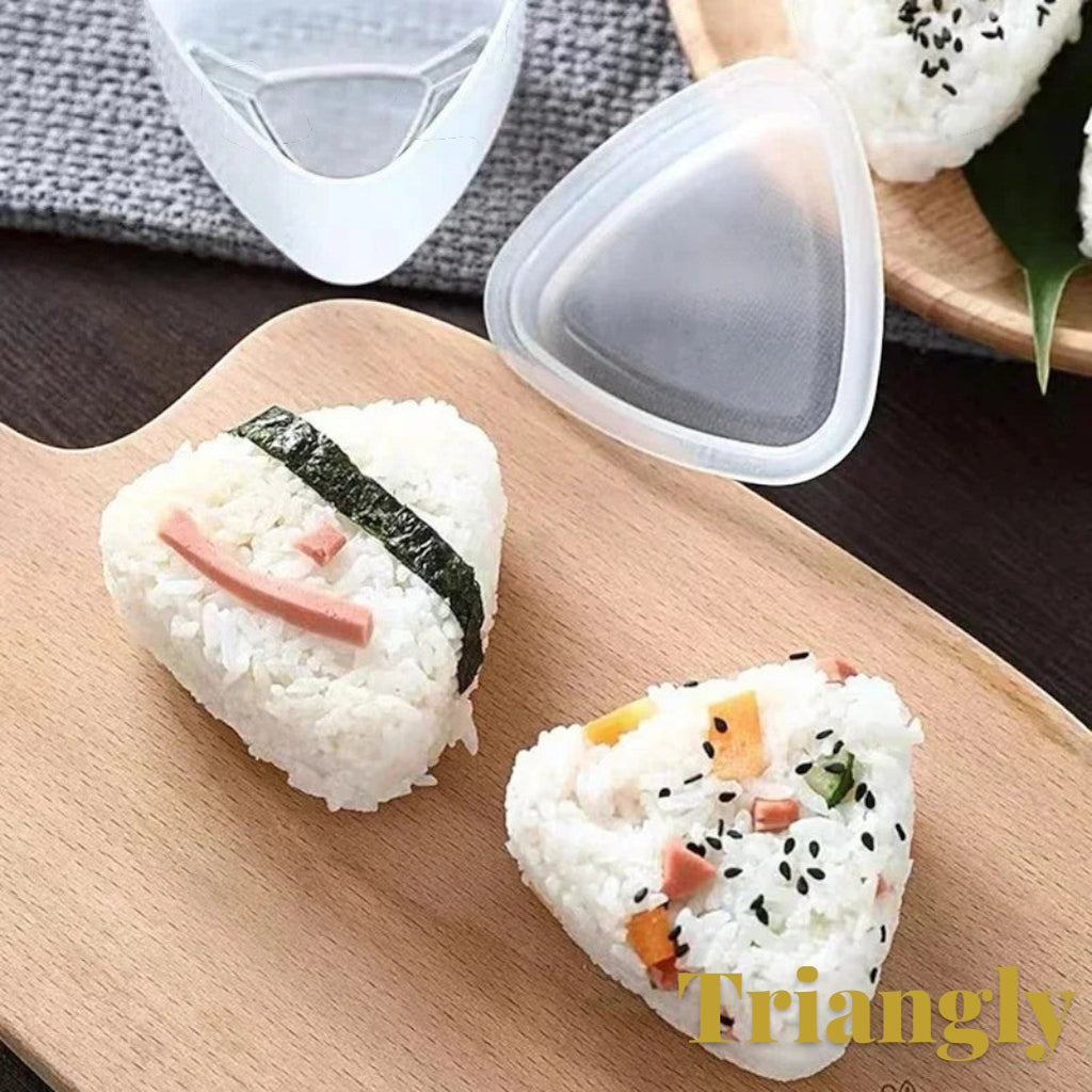 Gr8est triangle sushi and onigiri rice ball mold with two shaped rice balls on a wooden cutting board
