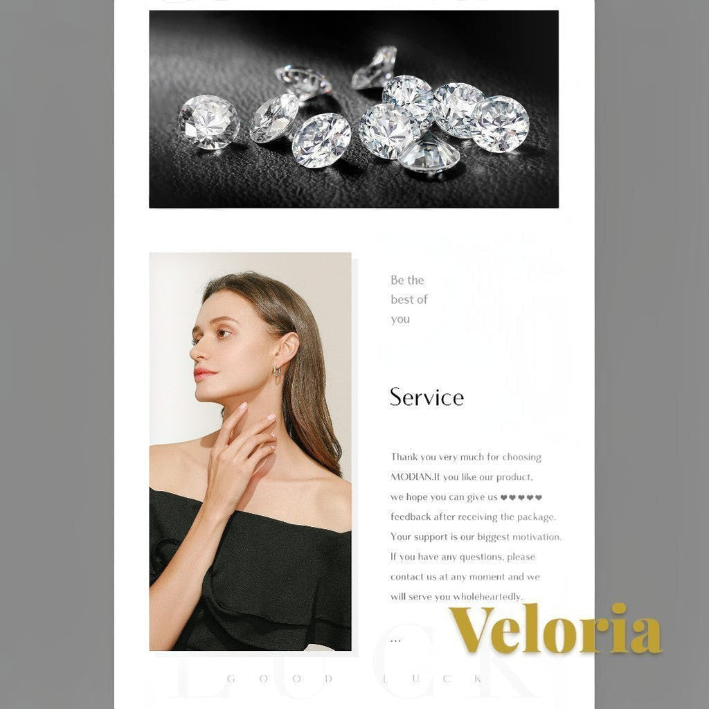 Gr8est Veloria moissanite pendant necklace worn by a model in a black off-shoulder top with loose sparkling stones