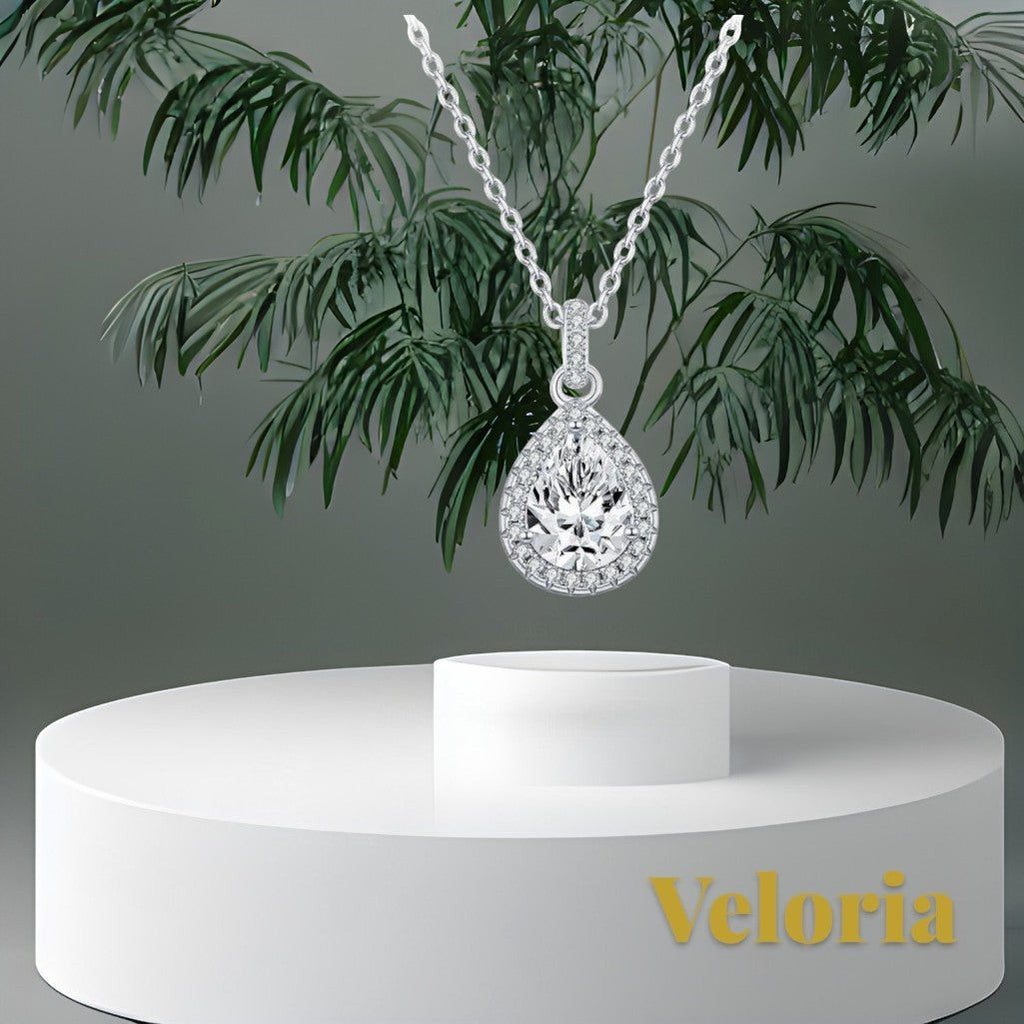 Gr8est Veloria 1.2CT pear-shaped moissanite pendant necklace in 925 sterling silver with a delicate halo setting.
